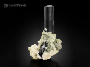 Large schorl tourmaline crystal on albite and muscovite matrix with sharp vertical striations