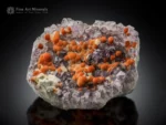 Rare orange scolecite balls perched on purple amethyst matrix from Rio Grande do Sul, Brazil.