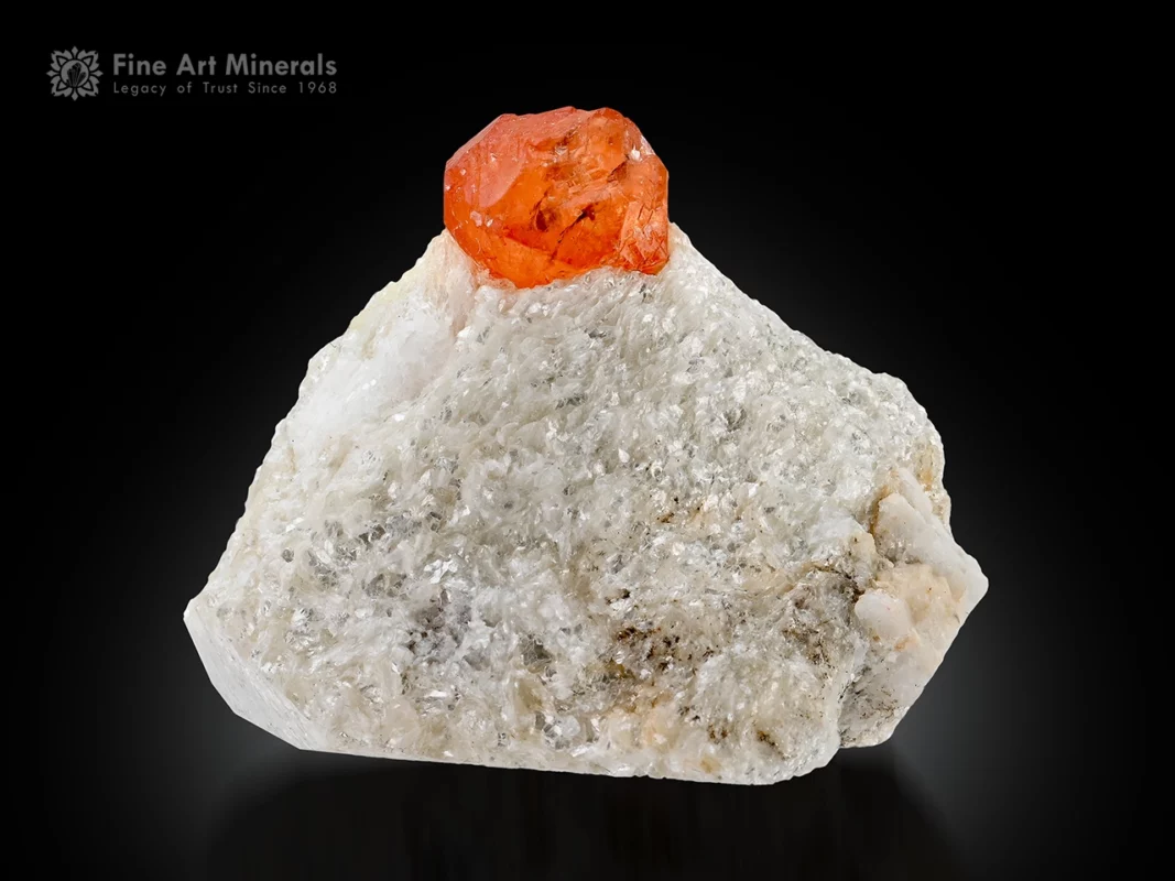 Orange spessartine garnet crystal perched on white matrix with excellent color and contrast.