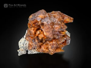 Brown synchysite crystal cluster with sharp terminations on contrasting matrix from Pakistan.