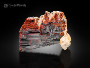 Well-formed tantalite crystal with calcite from the Mawi Pegmatite, Nuristan, Afghanistan.