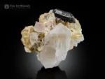 Lustrous Tantalite-(Mn) crystal associated with Quartz, Topaz, Albite, and Muscovite.