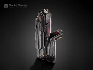 Sharp double-terminated rutile crystal from the Zagi Mountains with prominent vertical striations.