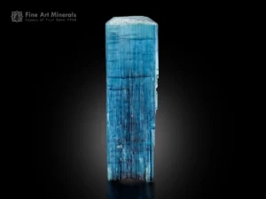 Blue tourmaline crystal with flat termination, strong vertical striations, and attractive prismatic form.