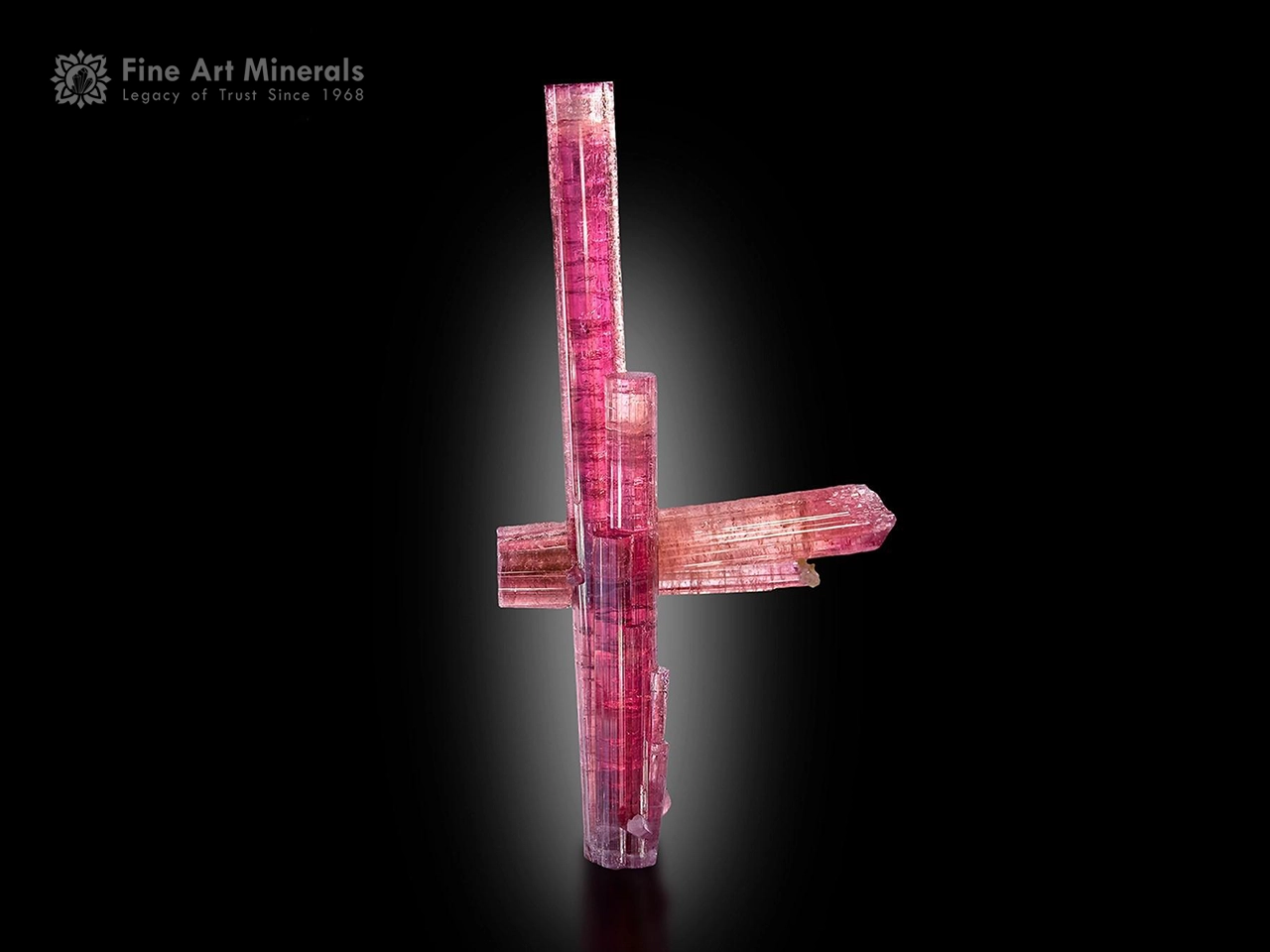 Rare wine-pink to raspberry-red tourmaline floater with sharp terminations from Ouro Fino pegmatite, Brazil.